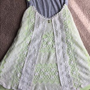 Crochet style green tank with curved hem. Size L